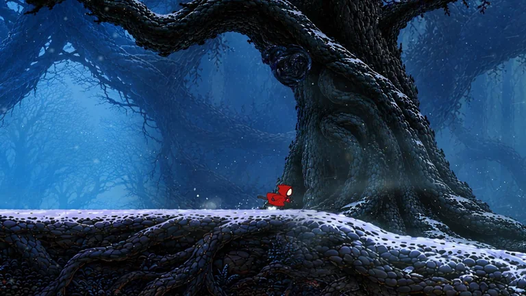 The cat crosses a snow-covered root beneath a giant tree in the blue woods